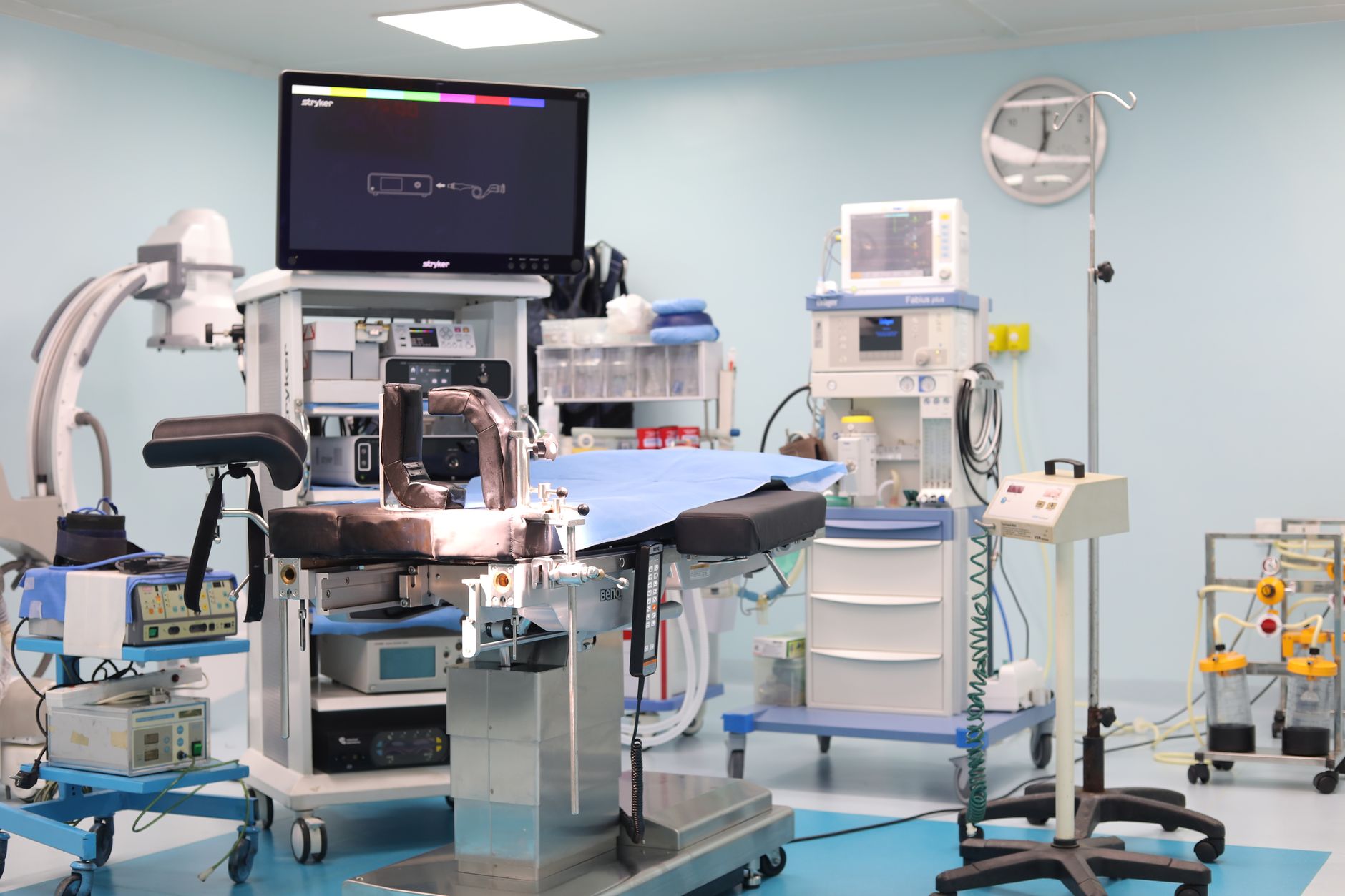 an operating room with anesthesia equipment and a surgical table